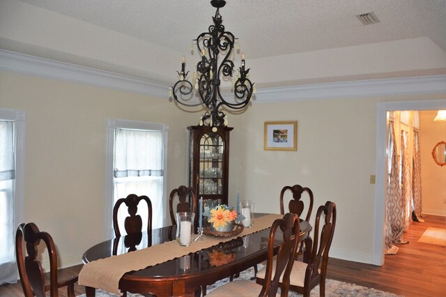 3374 Lake Oak Ridge Dr, Enterprise, AL 36330 - dining room with a chandelier, ornamental molding, baseboards, and wood finished floors