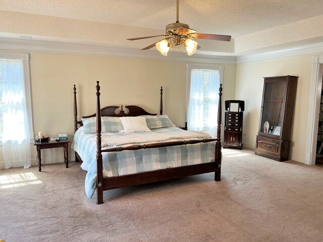 3374 Lake Oak Ridge Dr, Enterprise, AL 36330 - bedroom with light carpet, crown molding, a textured ceiling, a ceiling fan, and baseboards