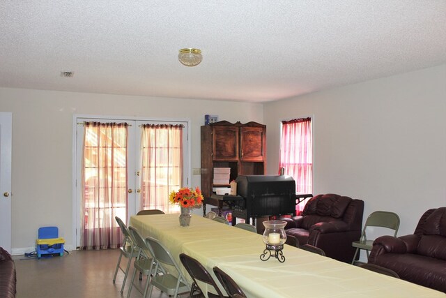 3374 Lake Oak Ridge Dr, Enterprise, AL 36330 - dining space featuring french doors and a textured ceiling