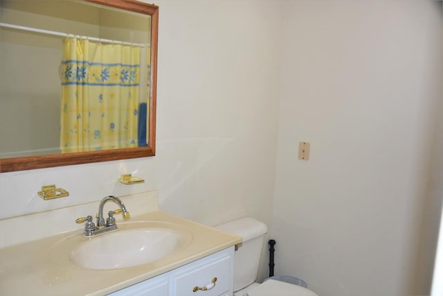 3374 Lake Oak Ridge Dr, Enterprise, AL 36330 - bathroom featuring vanity, toilet, and curtained shower