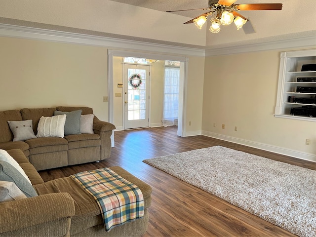 3374 Lake Oak Ridge Dr, Enterprise, AL 36330 - living area featuring dark wood-style flooring, crown molding, ceiling fan, and baseboards