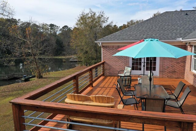 3374 Lake Oak Ridge Dr, Enterprise, AL 36330 - wooden terrace featuring a water view, outdoor dining space, and french doors