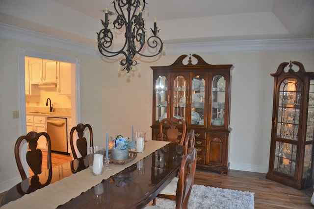 3374 Lake Oak Ridge Dr, Enterprise, AL 36330 - dining room with a chandelier, wood finished floors, baseboards, and ornamental molding