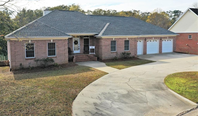 3374 Lake Oak Ridge Dr, Enterprise, AL 36330 - ranch-style home featuring roof with shingles, concrete driveway, brick siding, a front lawn, and a garage