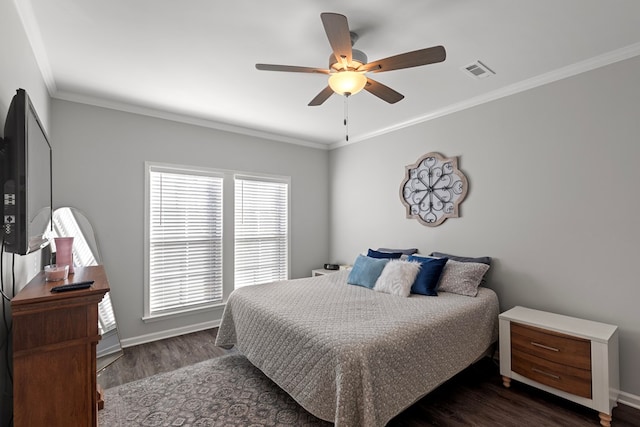 bedroom featuring dark wood-type flooring, ceiling fan, and ornamental molding