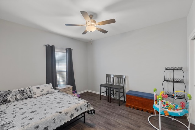 bedroom featuring ceiling fan and dark hardwood / wood-style floors