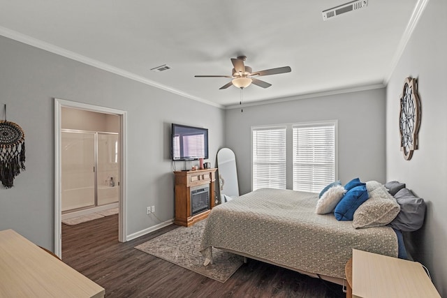 bedroom featuring ceiling fan, dark wood-type flooring, ornamental molding, and ensuite bath