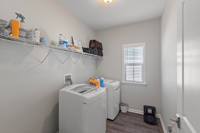 washroom featuring washer and clothes dryer and dark hardwood / wood-style floors