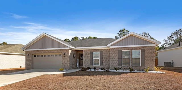 view of front of property with cooling unit and a garage