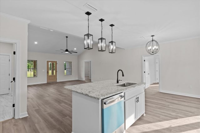 kitchen featuring white cabinets, a sink, visible vents, pendant lighting, and dishwasher