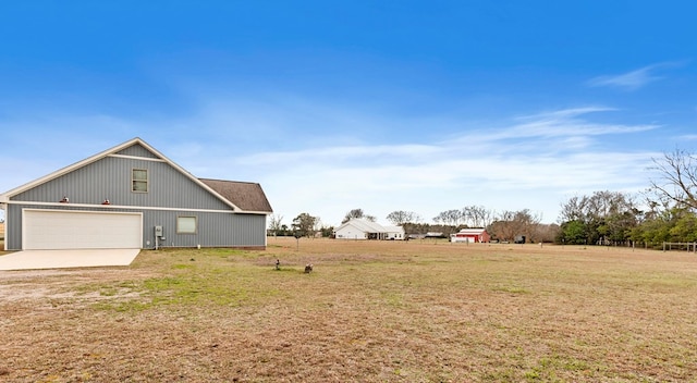 view of side of home with a lawn