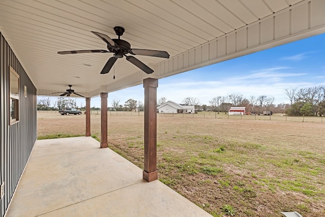 view of patio with a rural view and ceiling fan