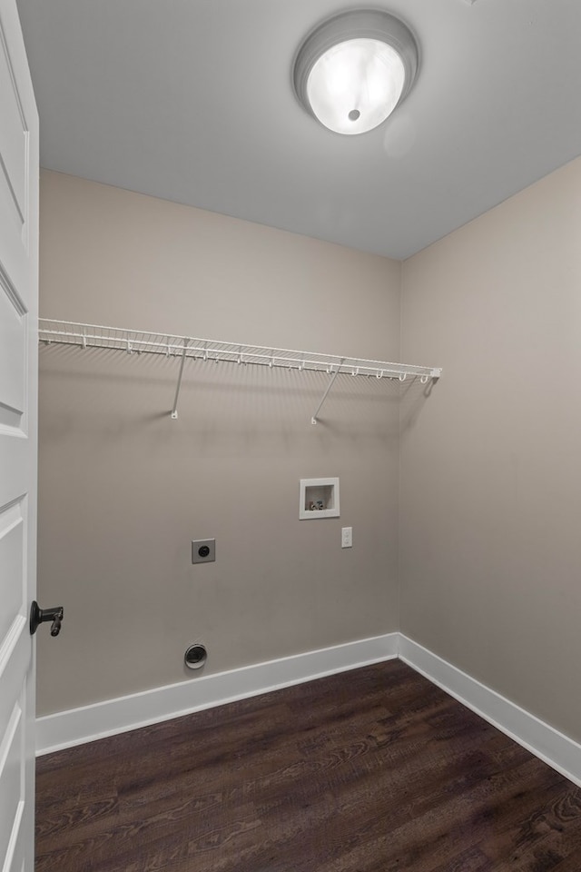 laundry room featuring dark wood-type flooring, hookup for an electric dryer, and hookup for a washing machine