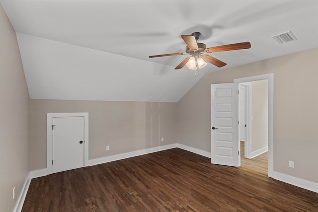 bonus room featuring ceiling fan, lofted ceiling, and dark hardwood / wood-style flooring