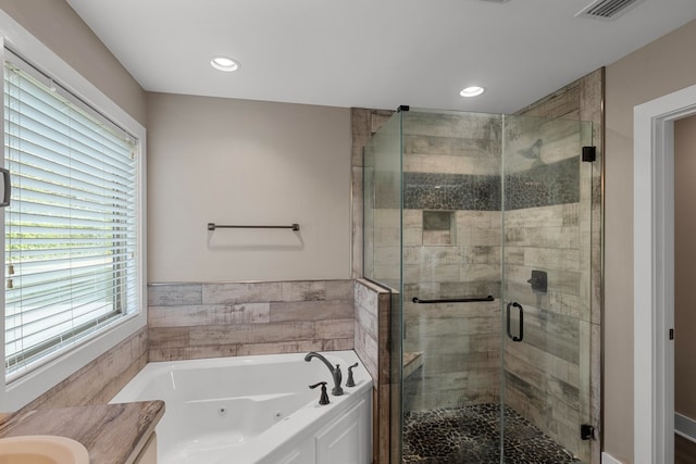 bathroom with vanity and plus walk in shower