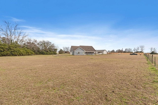 view of yard with a rural view