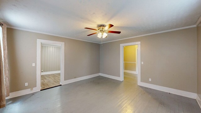 431 E Eufaula St, Ozark, AL 36360 - unfurnished room with ceiling fan, hardwood / wood-style floors, baseboards, and ornamental molding