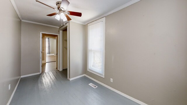 431 E Eufaula St, Ozark, AL 36360 - spare room featuring baseboards, wood finished floors, ceiling fan, and crown molding