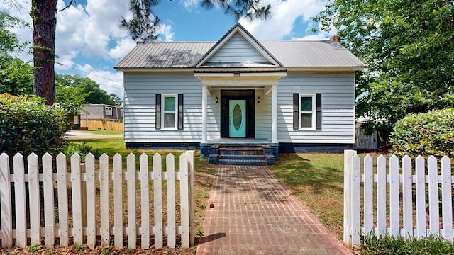 431 E Eufaula St, Ozark, AL 36360 - view of front facade featuring crawl space and metal roof