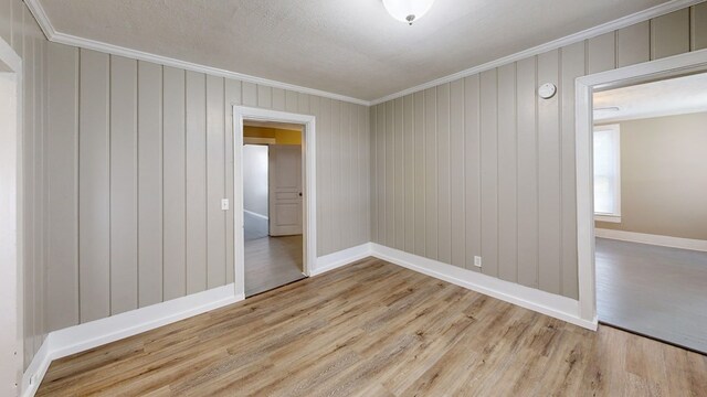 431 E Eufaula St, Ozark, AL 36360 - empty room with ornamental molding, wood finished floors, and baseboards