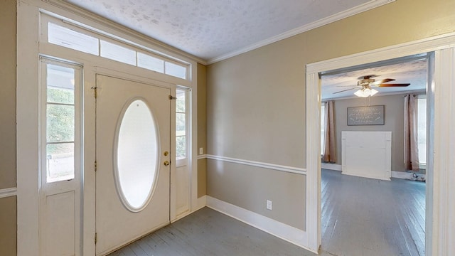 431 E Eufaula St, Ozark, AL 36360 - entryway with hardwood / wood-style flooring, healthy amount of natural light, crown molding, ceiling fan, and baseboards