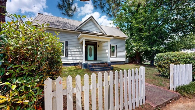 431 E Eufaula St, Ozark, AL 36360 - bungalow-style home featuring crawl space and metal roof
