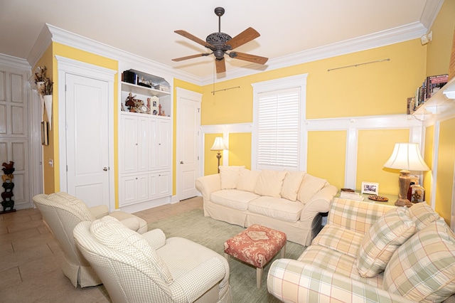 tiled living room featuring ceiling fan, crown molding, and built in features