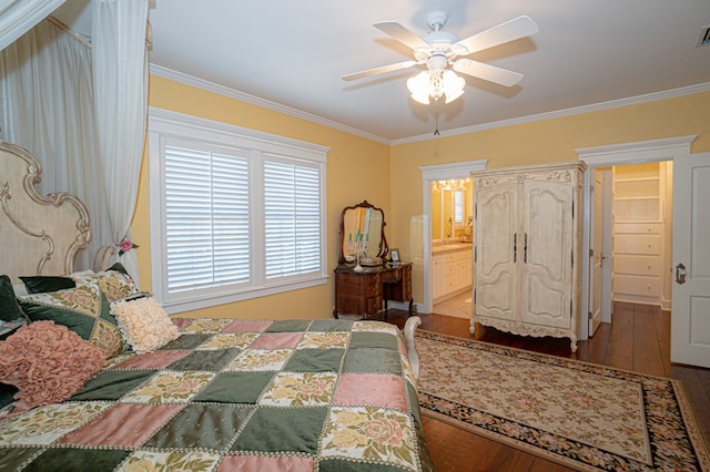 bedroom featuring ensuite bath, ceiling fan, crown molding, and wood-type flooring