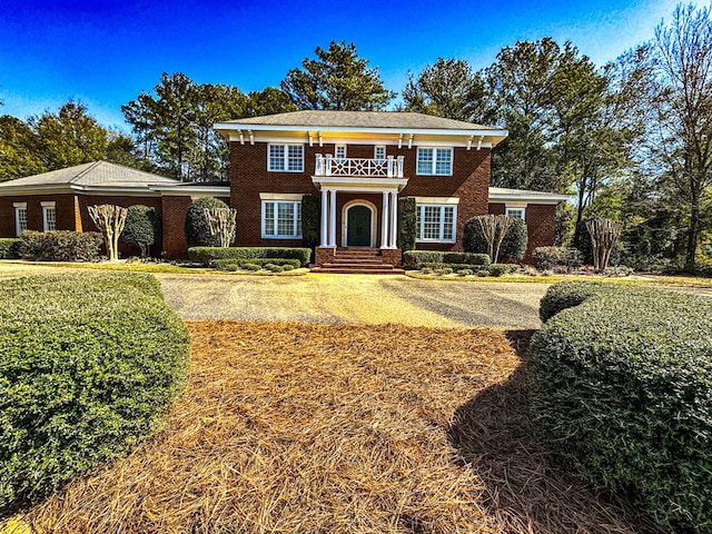 view of front of home with a balcony