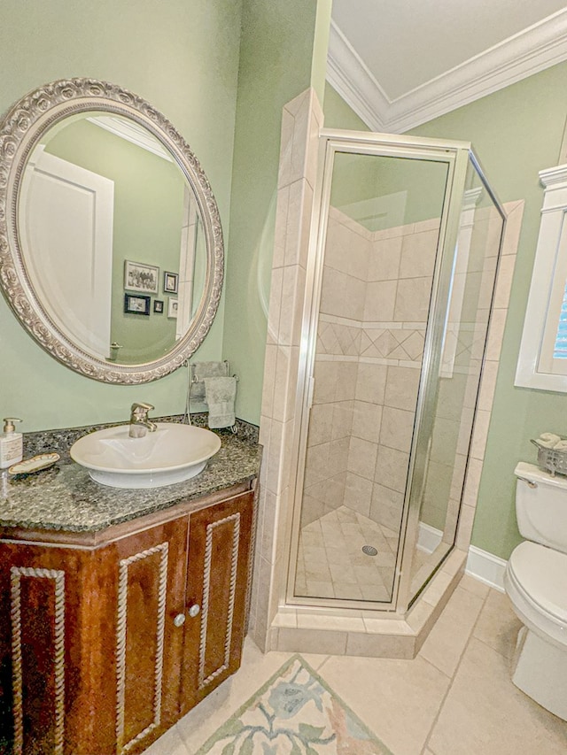 bathroom featuring walk in shower, tile patterned flooring, toilet, vanity, and ornamental molding