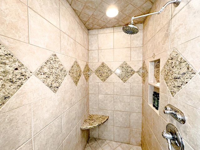 room details featuring a tile shower