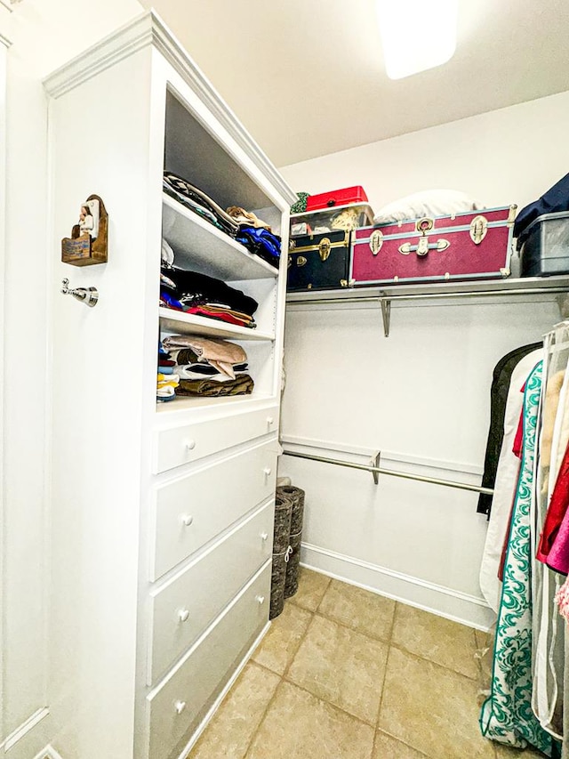 walk in closet featuring tile patterned flooring