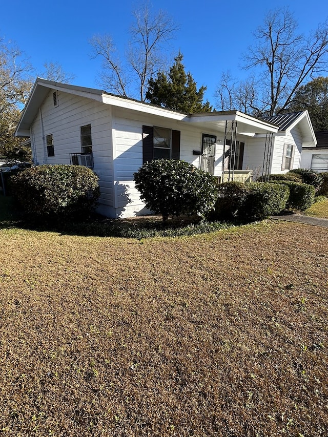 view of property exterior with covered porch