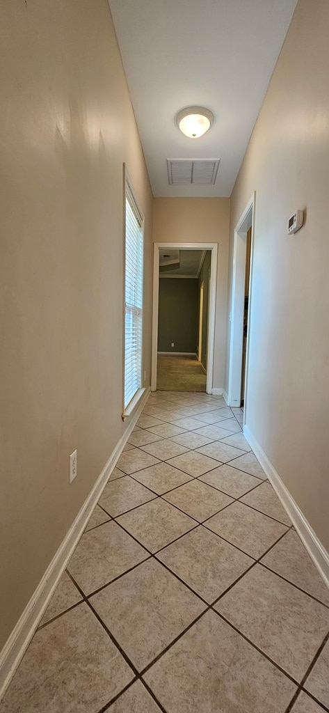 hallway with light tile patterned flooring