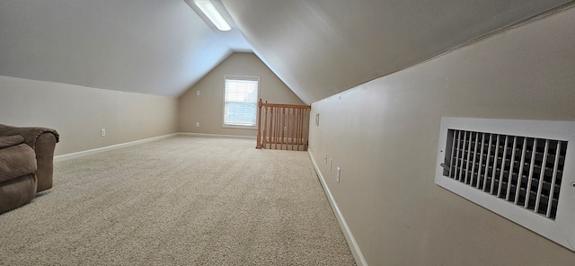 bonus room featuring carpet floors and vaulted ceiling