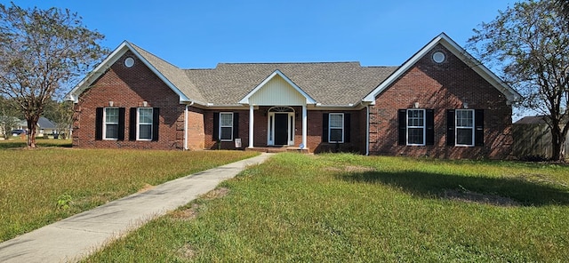 single story home featuring a front yard