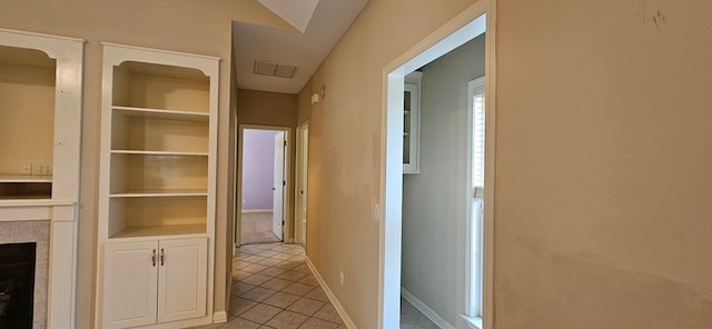 hallway featuring light tile patterned floors