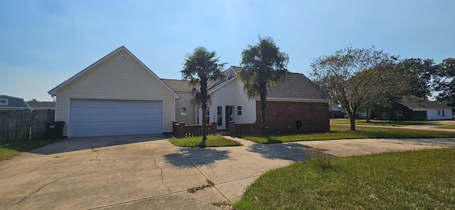 single story home with a garage and a front lawn