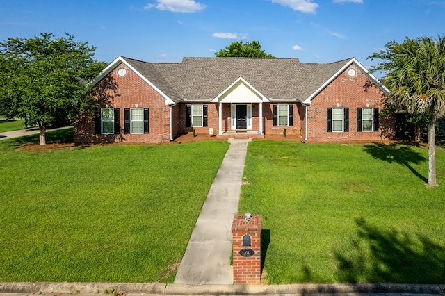 ranch-style home featuring a front yard