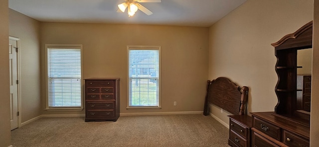 bedroom with light colored carpet and ceiling fan