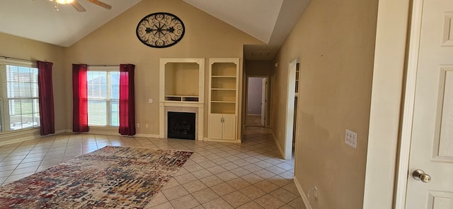 unfurnished living room with light tile patterned floors, high vaulted ceiling, and ceiling fan