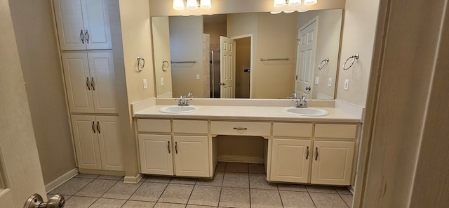 bathroom with tile patterned floors and vanity