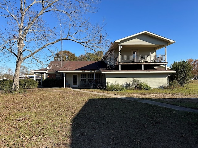 view of front of house featuring a balcony