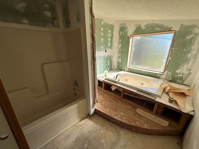 bathroom with a textured ceiling, separate shower and tub, and vaulted ceiling