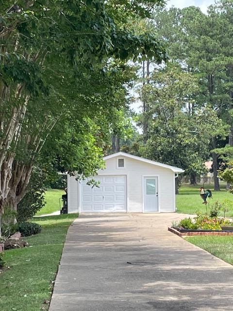 garage with a yard