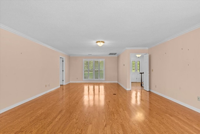 105 Christen Ln, Dothan, AL 36305 - spare room featuring light wood finished floors, a textured ceiling, baseboards, visible vents, and ornamental molding