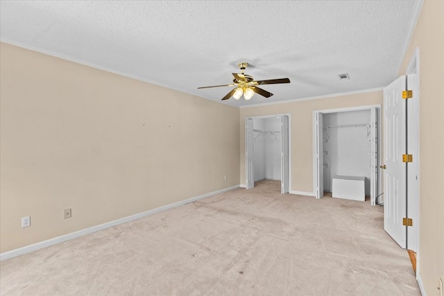 105 Christen Ln, Dothan, AL 36305 - unfurnished bedroom with light carpet, a textured ceiling, multiple closets, baseboards, and visible vents