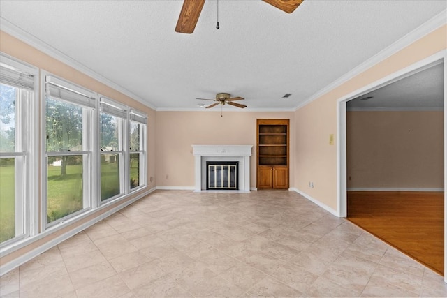 105 Christen Ln, Dothan, AL 36305 - unfurnished living room with a ceiling fan, crown molding, a glass covered fireplace, and a textured ceiling