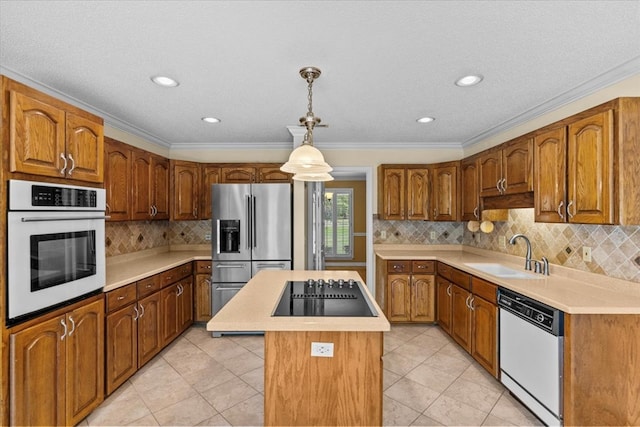 105 Christen Ln, Dothan, AL 36305 - kitchen featuring a kitchen island, light countertops, a sink, and white appliances