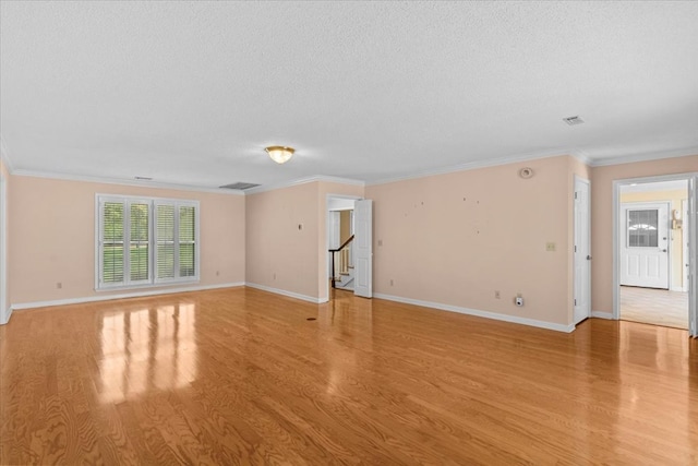 105 Christen Ln, Dothan, AL 36305 - empty room with crown molding, light wood-style floors, stairway, and a textured ceiling